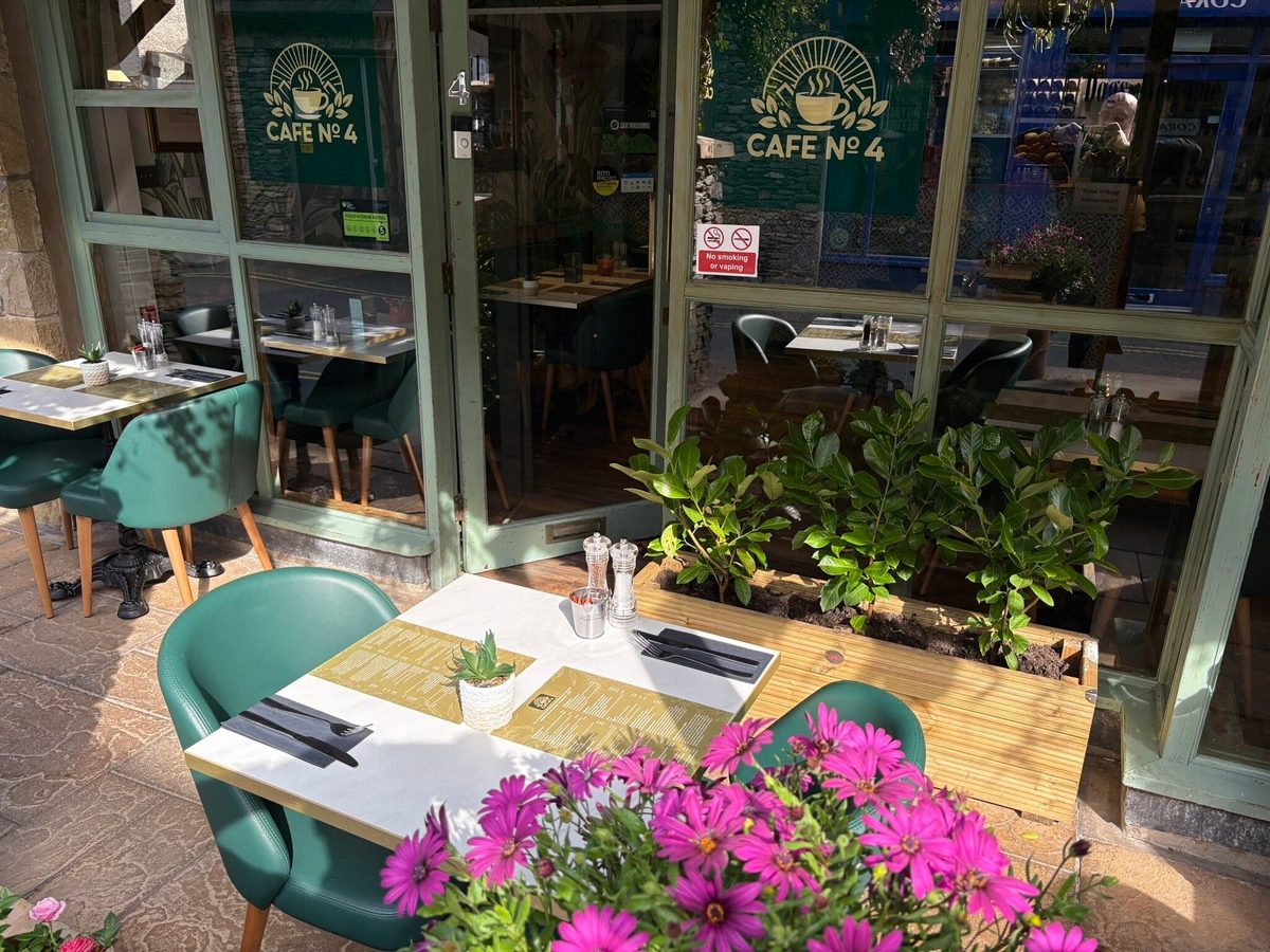 Inside Cafe No.4: green banquettes and tables